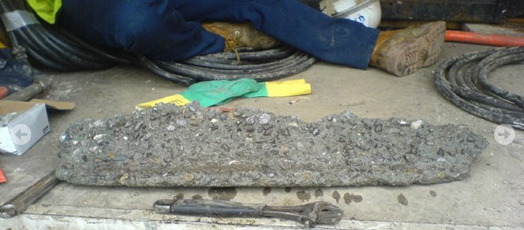 example of concrete removed from drain