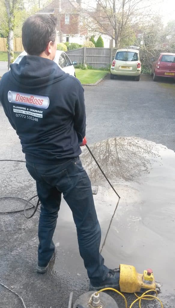 Man clearing someones drains